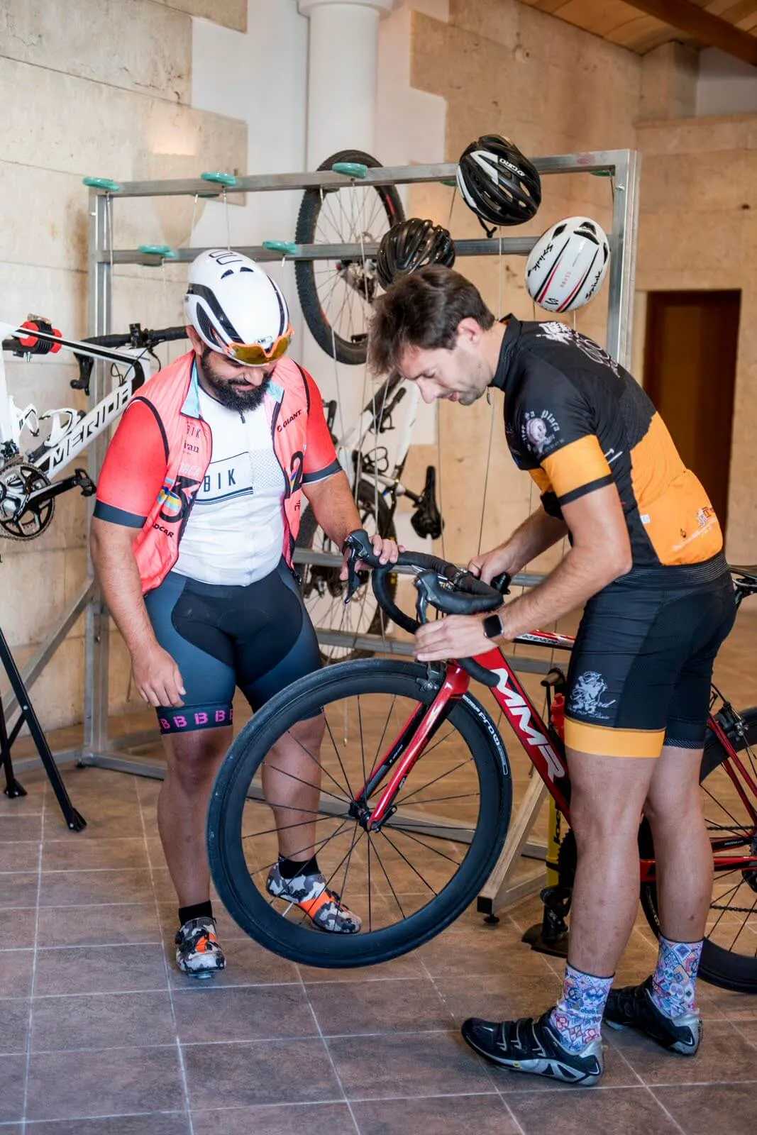 Riders adjusting their bikes