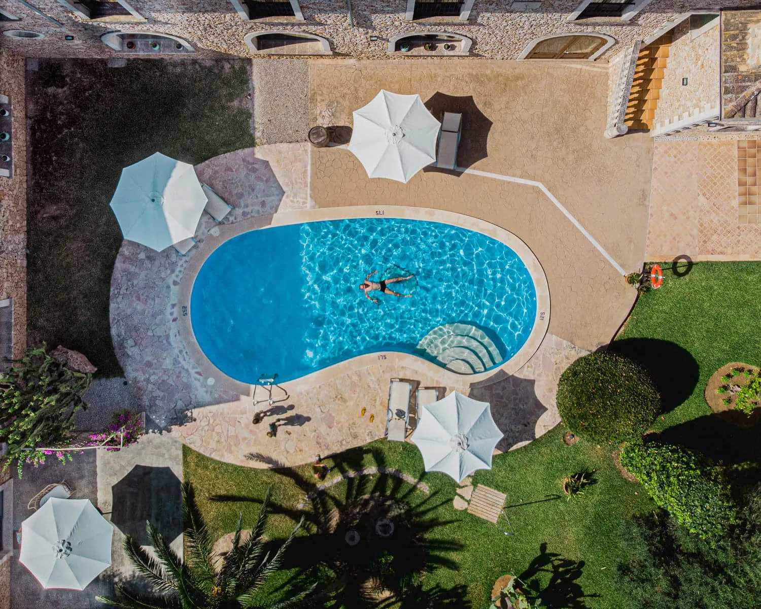 Aerial view of Curolla with its garden and pool