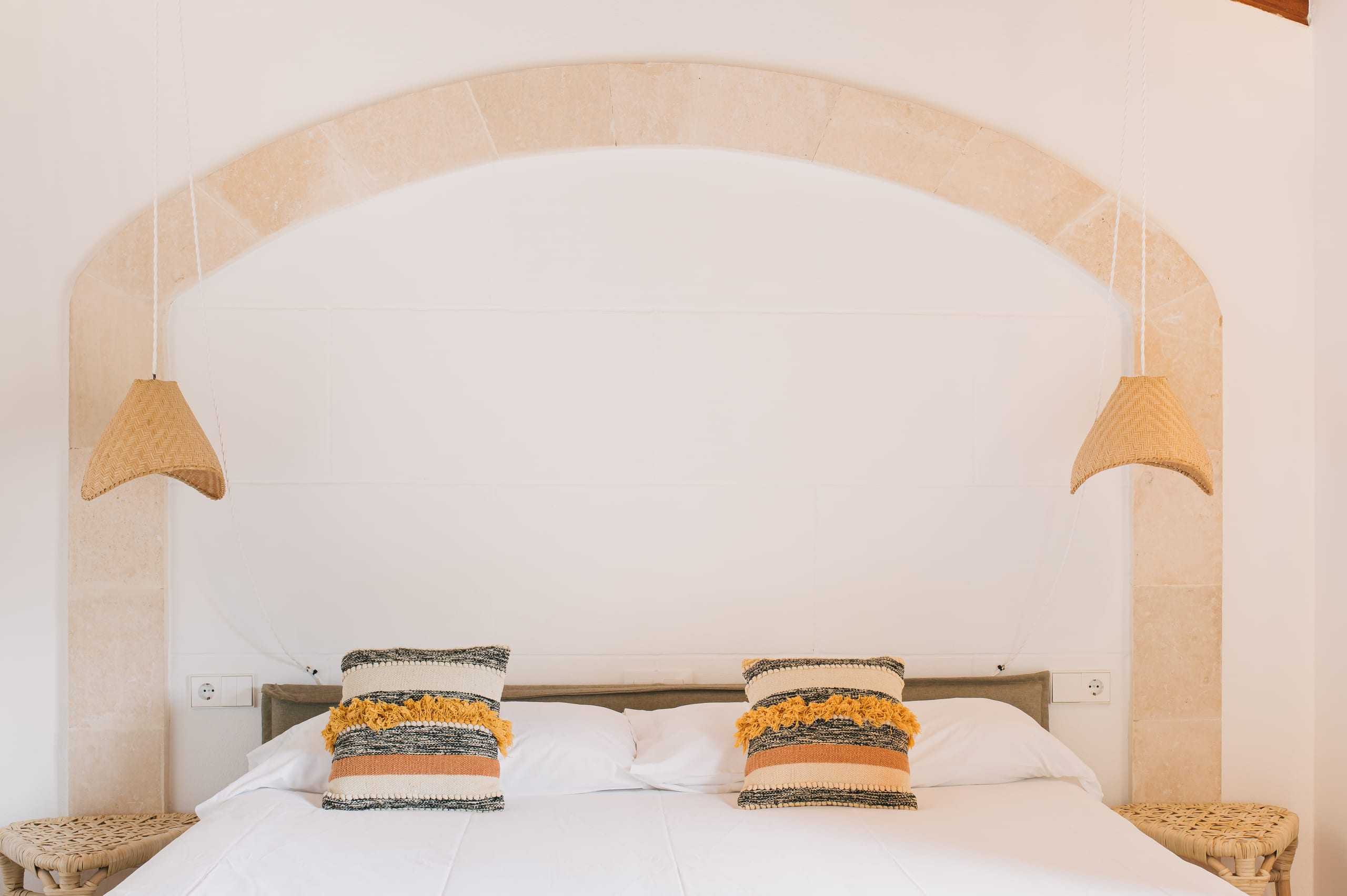 Bedroom under a stone arch